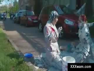 Two classy MILFs involved in paint fight outside